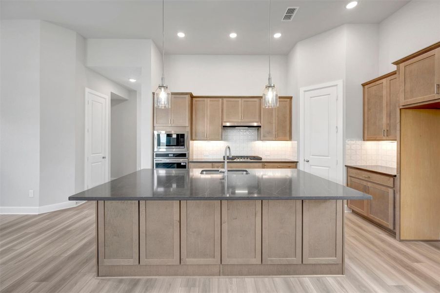 Furnished interior view inside a new home in Sienna - Landmark Row Collection, Missouri City (Image 4).