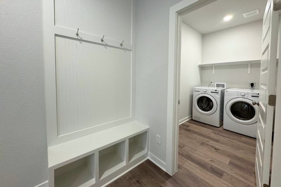 A room with a washer and dryer. A room with a washer and dryer.