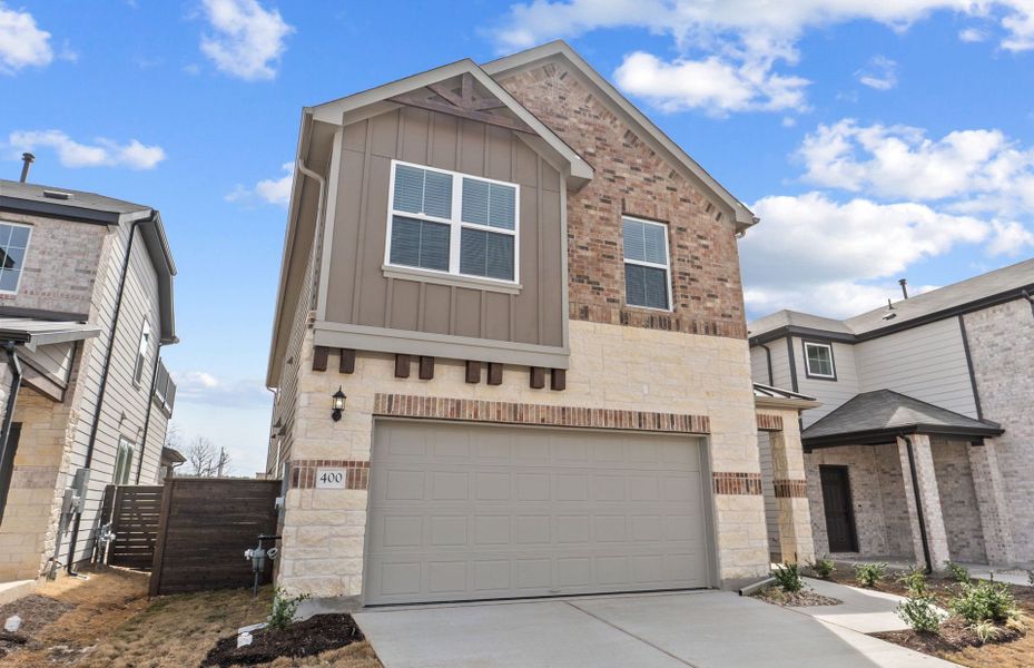 Front exterior of a new home in Horizon Lake, Leander, TX, highlighting curb appeal (Image 1). Front exterior of a new home in Horizon Lake, Leander, TX, highlighting curb appeal (Image 1).