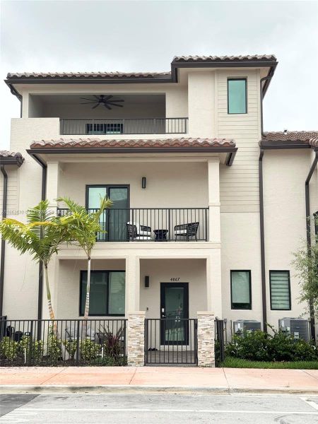 Front exterior of a new home in , Doral, FL, highlighting curb appeal (Image 1).