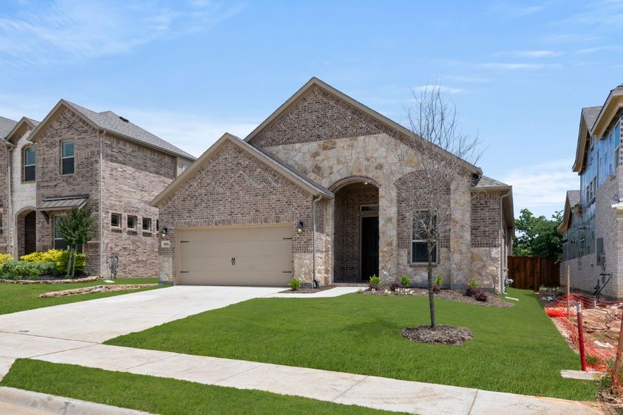 Front exterior of a new home in Walton Ridge, Corinth, TX, highlighting curb appeal (Image 2). Front exterior of a new home in Walton Ridge, Corinth, TX, highlighting curb appeal (Image 2).
