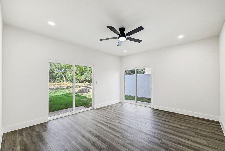 Empty room featuring recessed lighting, dark wood finished floors, and a ceiling fan