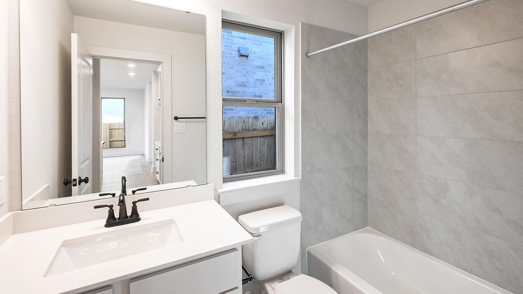 Furnished interior view inside a new home in Crosswinds 50', Kyle (Image 11).