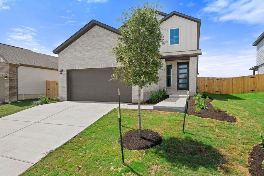 Front exterior of a new home in Terrace Collection At Turner's Crossing, Buda, TX, highlighting curb appeal (Image 1). Front exterior of a new home in Terrace Collection At Turner's Crossing, Buda, TX, highlighting curb appeal (Image 1).