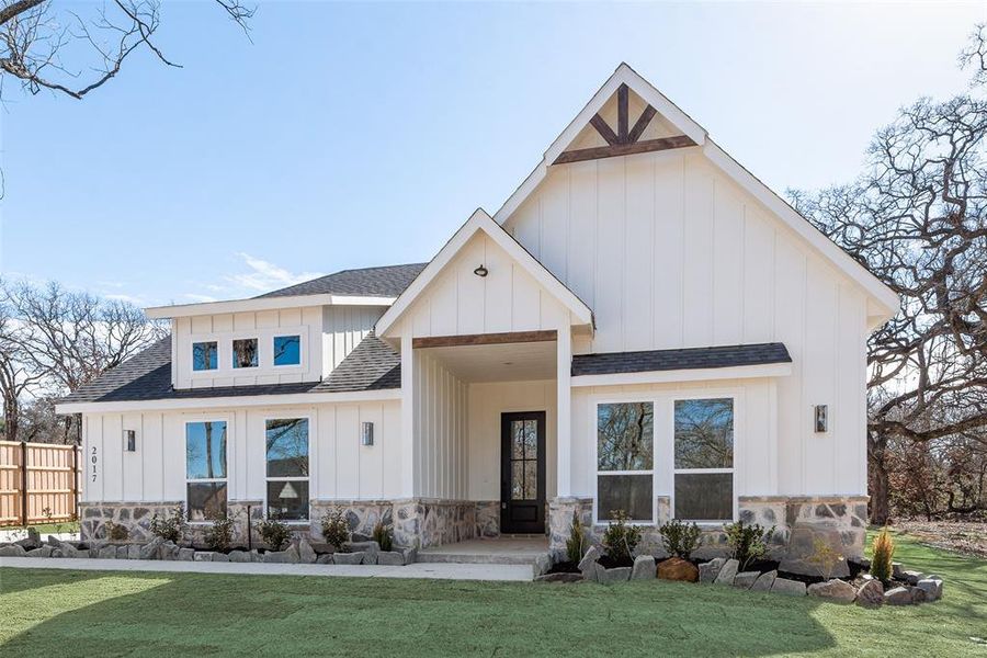 Front exterior of a new home in , Azle, TX, highlighting curb appeal (Image 24). Front exterior of a new home in , Azle, TX, highlighting curb appeal (Image 24).