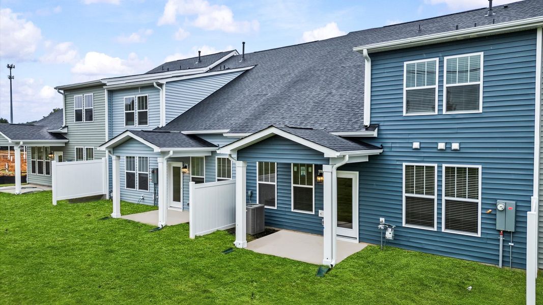 Accomplished exterior with a spacious rear porch that blends comfort and style at Silo Ridge by DRB Homes in Anderson, SC
