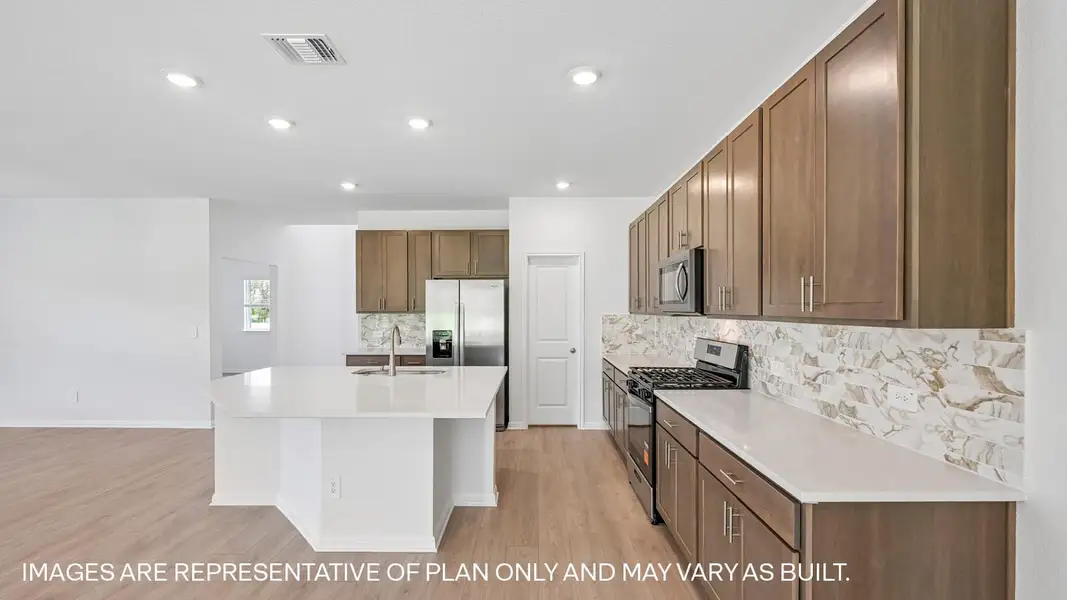 Representative furnished interior of a home built from the The Kemah by D.R. Horton in Revelry, Del Valle (Image 7).