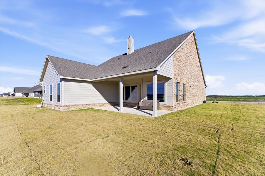 Exterior details and patio area of a home in Clear Sky Addition, Valley View (Image 28).