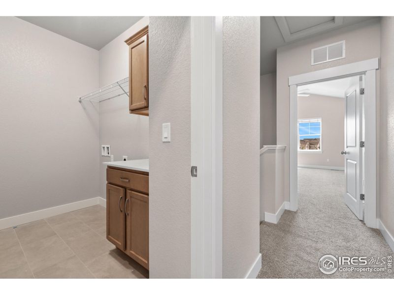 Upstairs dedicated laundry room