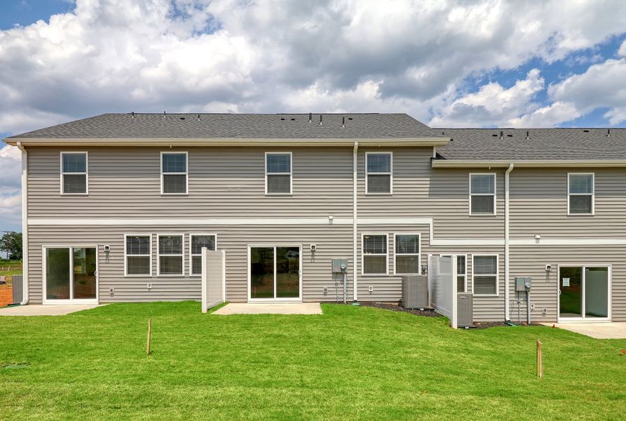 Representative exterior photo of a completed home built from the Ivey by Hunter Quinn Homes in Westgate Village Townes, Spartanburg, SC (Image 25). Representative exterior photo of a completed home built from the Ivey by Hunter Quinn Homes in Westgate Village Townes, Spartanburg, SC (Image 25).