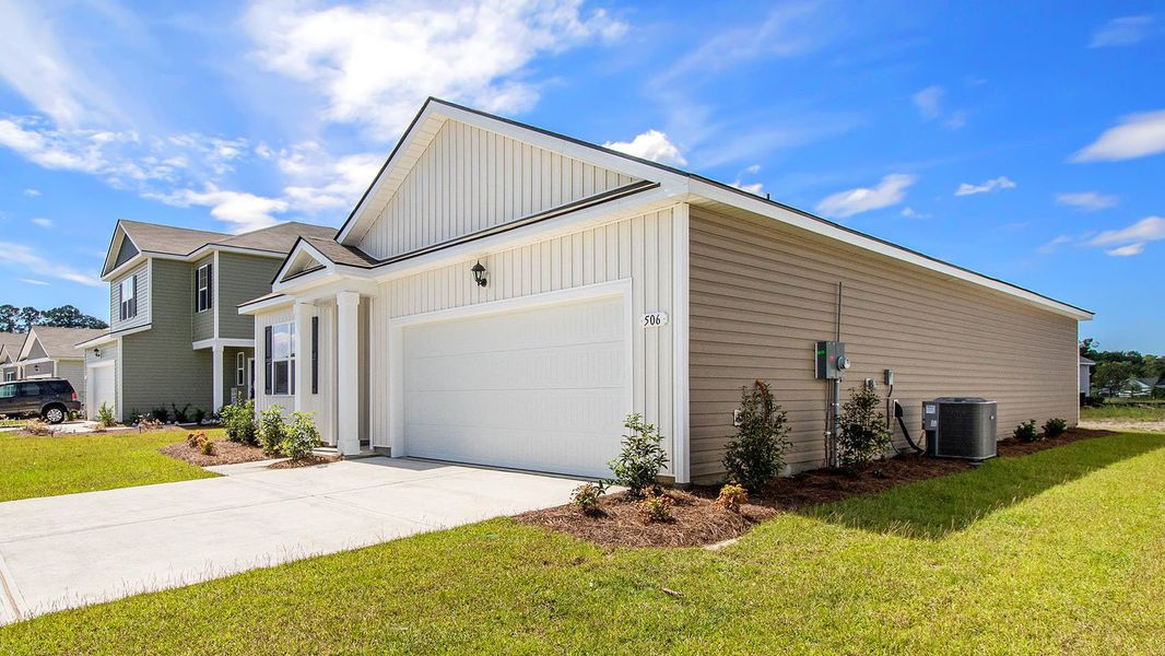 Front exterior of a new home in Harper Meadows, Loris, SC, highlighting curb appeal (Image 18). Front exterior of a new home in Harper Meadows, Loris, SC, highlighting curb appeal (Image 18).