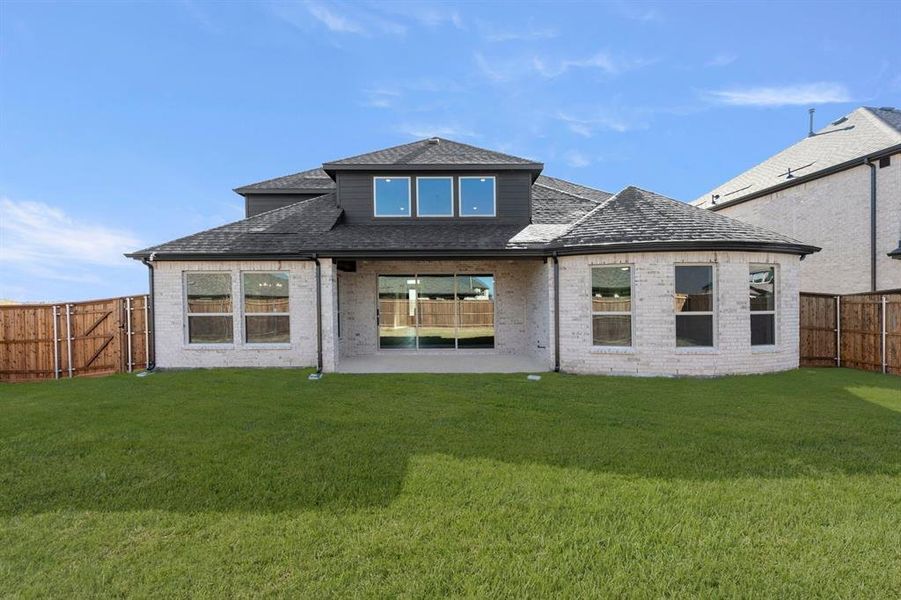 Exterior details and patio area of a home in Valencia on The Lake, Little Elm (Image 4).