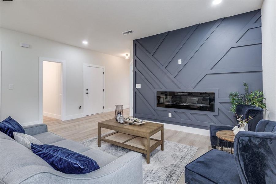 Living room with light wood-type flooring