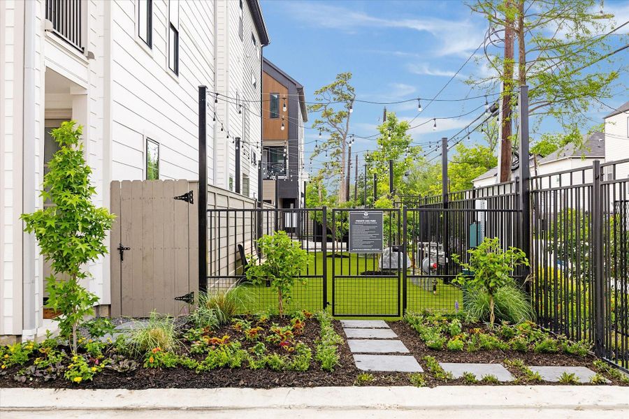 Nice garden and dog park adorned with quaint exterior lights. Nice garden and dog park adorned with quaint exterior lights.