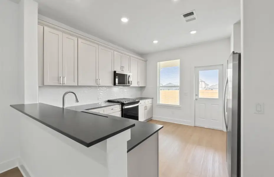 Furnished interior view inside a new home in Crosswinds, Kyle (Image 7).