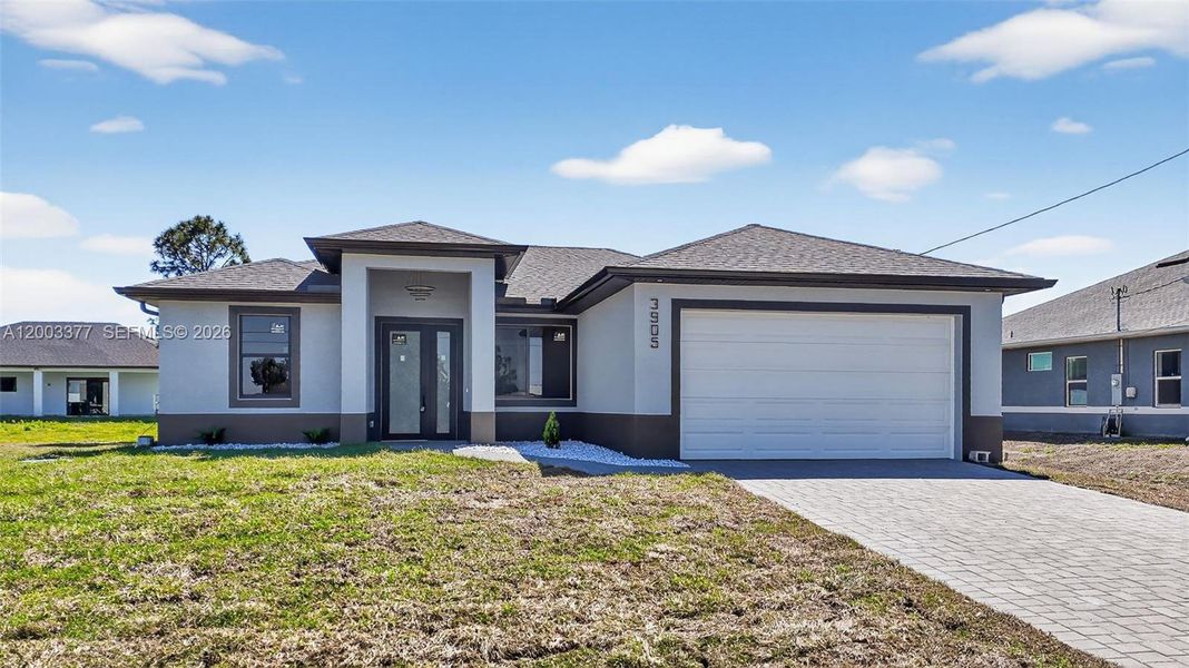 Front exterior of a new home in , Lehigh Acres, FL, highlighting curb appeal (Image 25).