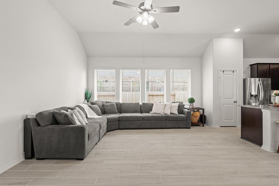 The open concept living room and kitchen makes for a great way to keep the party going and never miss a beat!