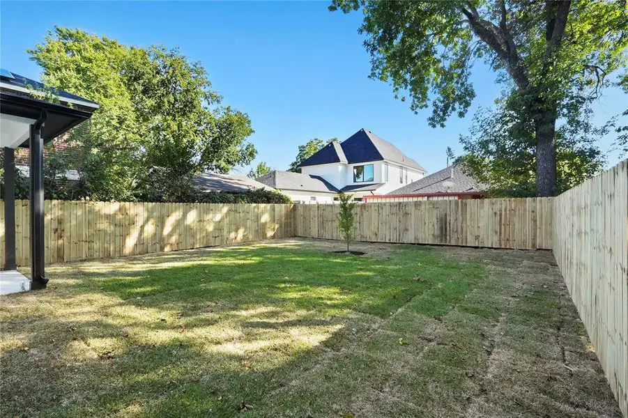View of fenced backyard