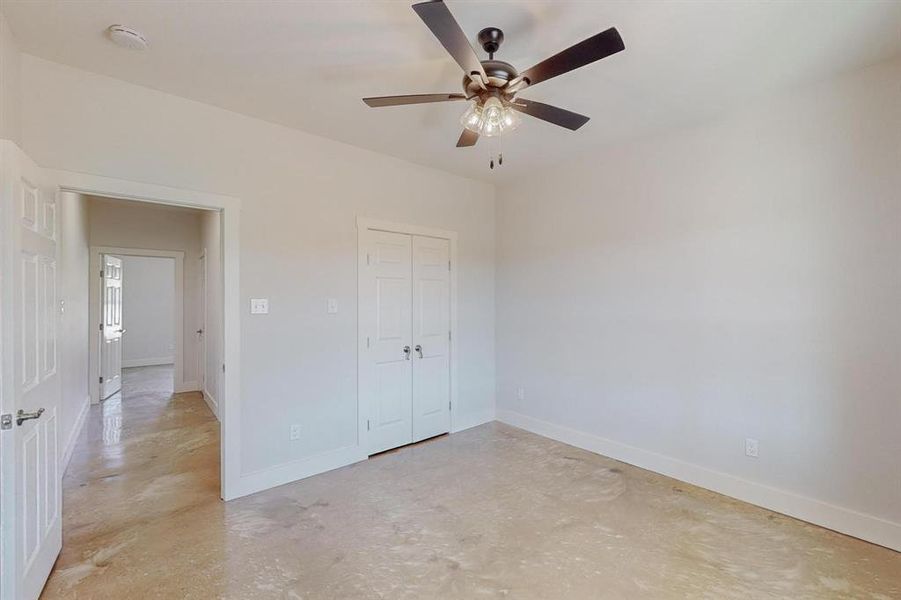 Unfurnished bedroom with a closet and ceiling fan