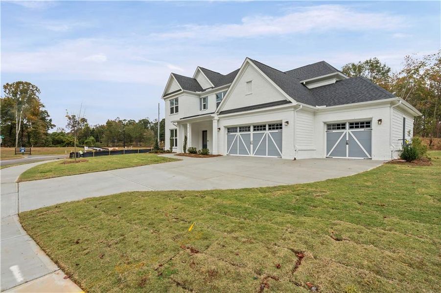 Front exterior of a new home in Rose Creek, Cumming, GA, highlighting curb appeal (Image 22).