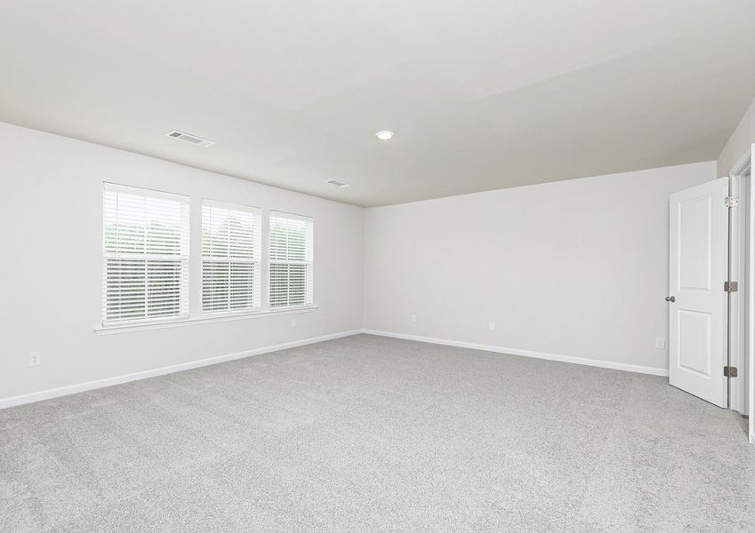 Rest and relaxation await in the master bedroom