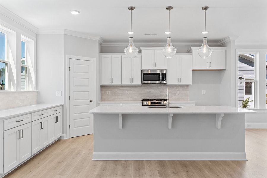 Representative furnished interior of a home built from the The Highland by RobuckHomes in Windwater, Hampstead (Image 6).