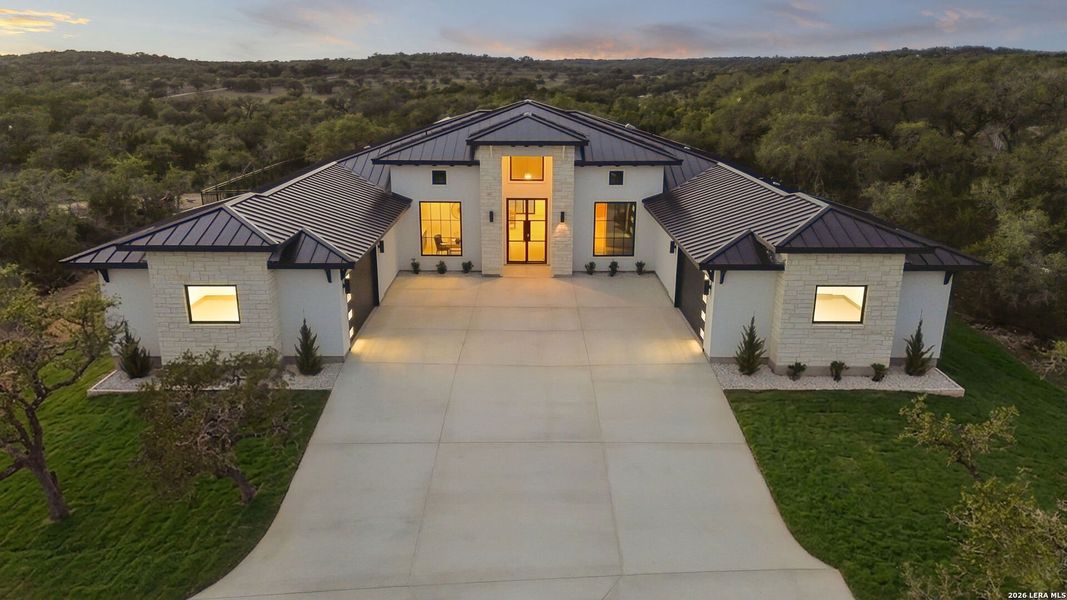 Front exterior of a new home in , Boerne, TX, highlighting curb appeal (Image 23).