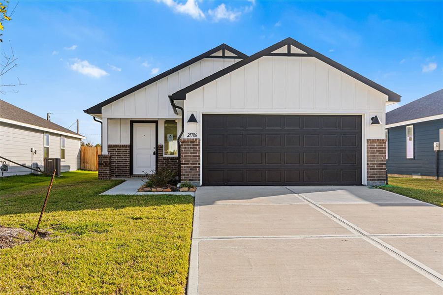 Front exterior of a new home in Hill & Dale Ranch, Splendora, TX, highlighting curb appeal (Image 2). Front exterior of a new home in Hill & Dale Ranch, Splendora, TX, highlighting curb appeal (Image 2).