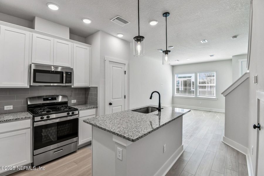 Furnished interior view inside a new home in Kettering at eTown - Garden Collection, Jacksonville (Image 4). Furnished interior view inside a new home in Kettering at eTown - Garden Collection, Jacksonville (Image 4).