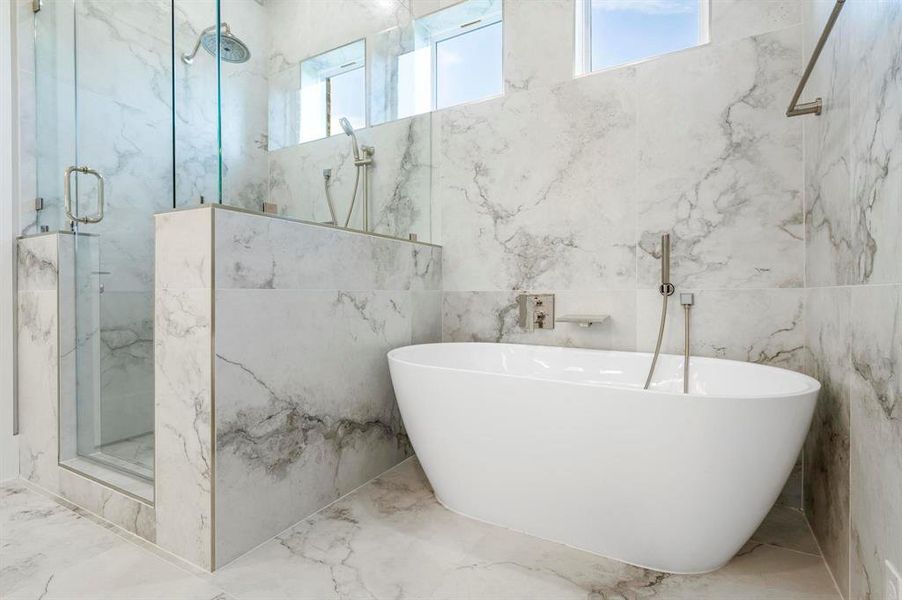 Bathroom featuring separate shower and tub