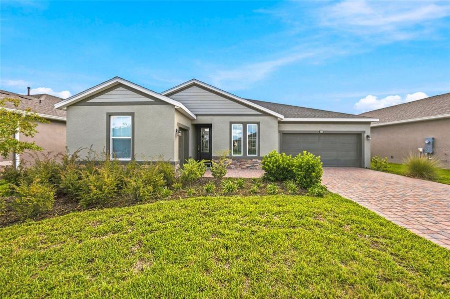 Front exterior of a new home in Ocala Preserve, Ocala, FL, highlighting curb appeal (Image 2).