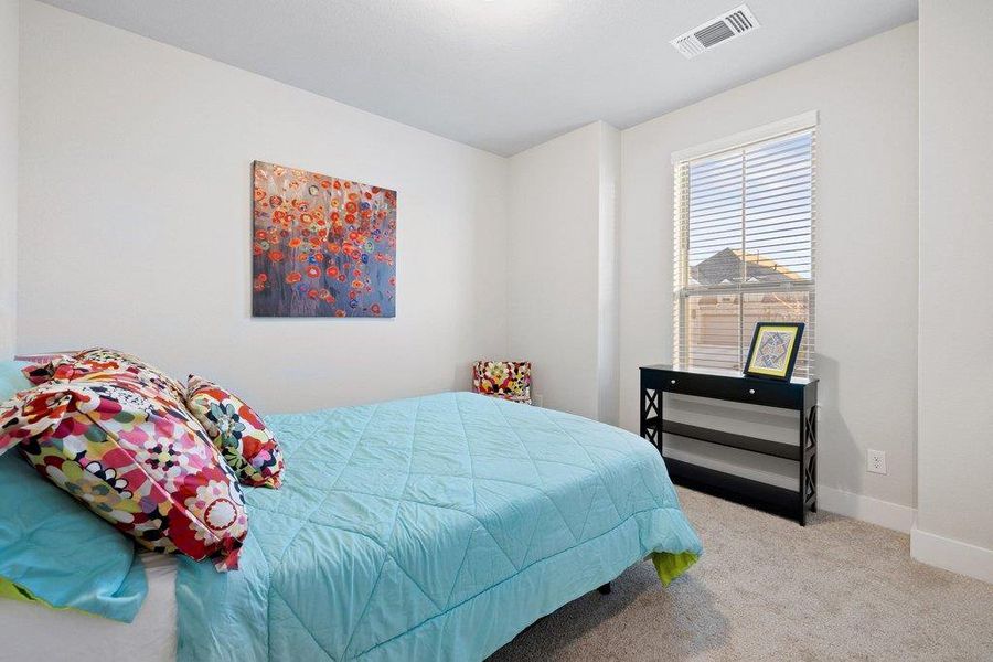 Well-appointed upstairs bedroom with great natural light and spacious closet.