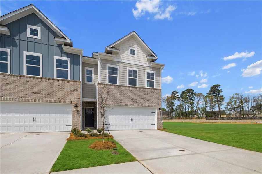 Front exterior of a new home in Langley Overlook, Loganville, GA, highlighting curb appeal (Image 17). Front exterior of a new home in Langley Overlook, Loganville, GA, highlighting curb appeal (Image 17).