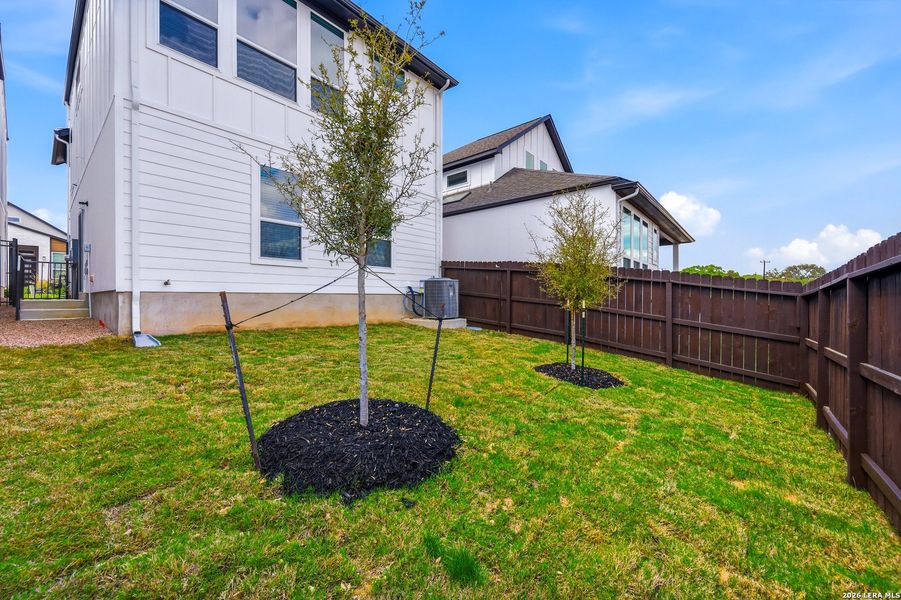 Exterior details and patio area of a home in Centero at Stone Oak, San Antonio (Image 4).