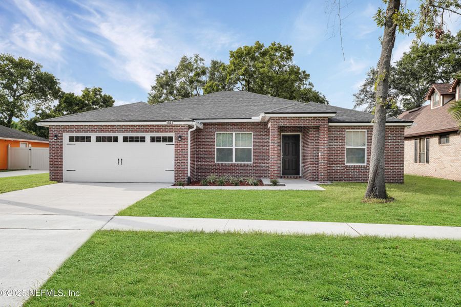 Front exterior of a new home in , Jacksonville, FL, highlighting curb appeal (Image 18).
