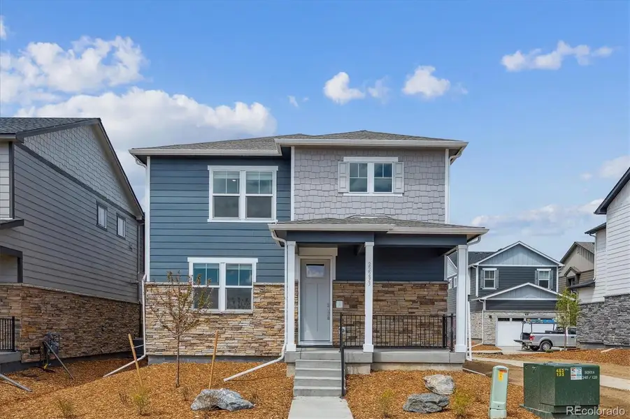 Exterior details and patio area of a home in Sky Ranch, Watkins (Image 1).