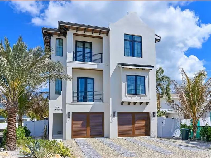 Front exterior of a new home in , Bradenton Beach, FL, highlighting curb appeal (Image 21).