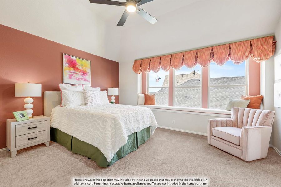 Bedroom with vaulted ceiling, window seat, ceiling fan, and terracotta accent wall Bedroom with vaulted ceiling, window seat, ceiling fan, and terracotta accent wall