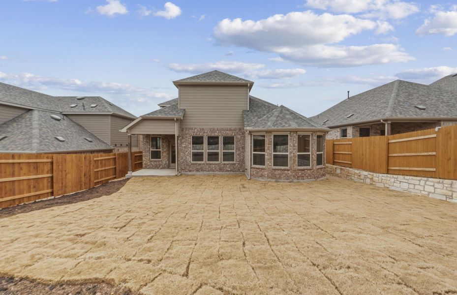 Exterior details and patio area of a home in West Cypress Hills, Spicewood (Image 28).