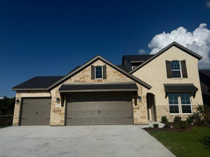 Front exterior of a new home in Waterford Park, Weatherford, TX, highlighting curb appeal (Image 2). Front exterior of a new home in Waterford Park, Weatherford, TX, highlighting curb appeal (Image 2).