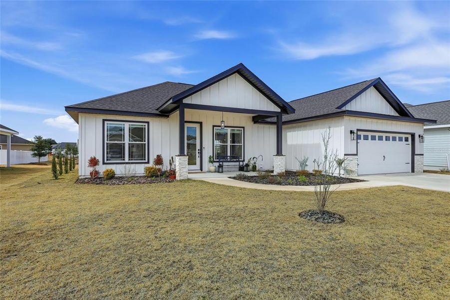 Front exterior of a new home in , Newberry, FL, highlighting curb appeal (Image 20).