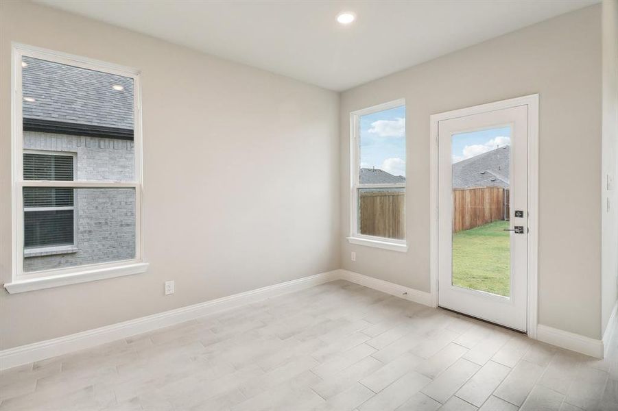 Spare room featuring light hardwood / wood-style flooring