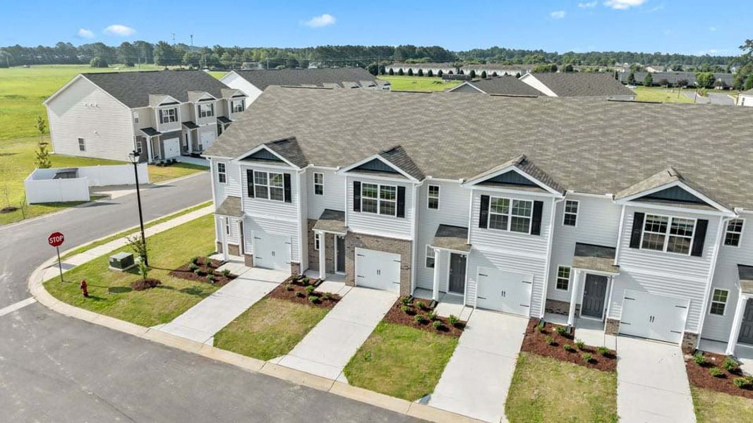 Representative exterior photo of a completed home built from the Pearson by D.R. Horton in The Townes at Ridgewood Farms, Winterville, NC (Image 15).