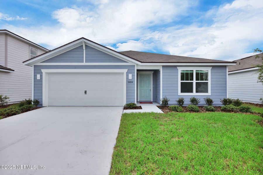 Front exterior of a new home in Wells Landing, Jacksonville, FL, highlighting curb appeal (Image 1). Front exterior of a new home in Wells Landing, Jacksonville, FL, highlighting curb appeal (Image 1).