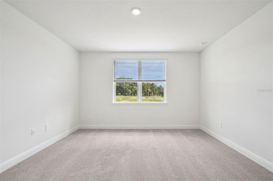 Spacious, unfurnished interior of a new home in The Reserve at Hammock Oaks - Signature Series, Lady Lake (Image 25).