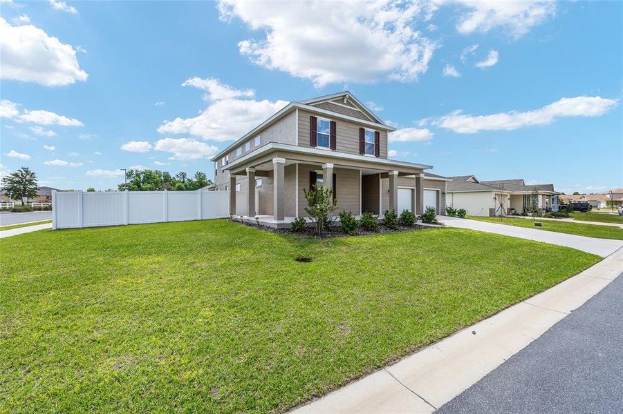 Front exterior of a new home in Calesa Township, Ocala, FL, highlighting curb appeal (Image 29). Front exterior of a new home in Calesa Township, Ocala, FL, highlighting curb appeal (Image 29).