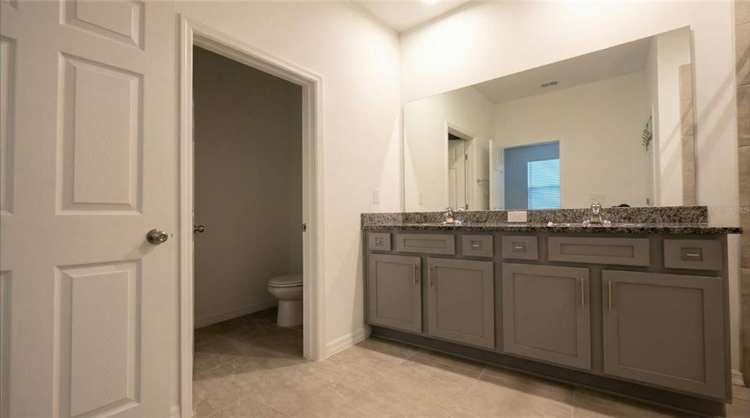 Furnished interior view inside a new home in Village at Windsor Reserve, Eagle Lake (Image 18).