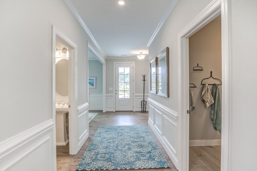 Representative furnished interior of a home built from the The Amherst by RobuckHomes in Windwater, Hampstead (Image 7).