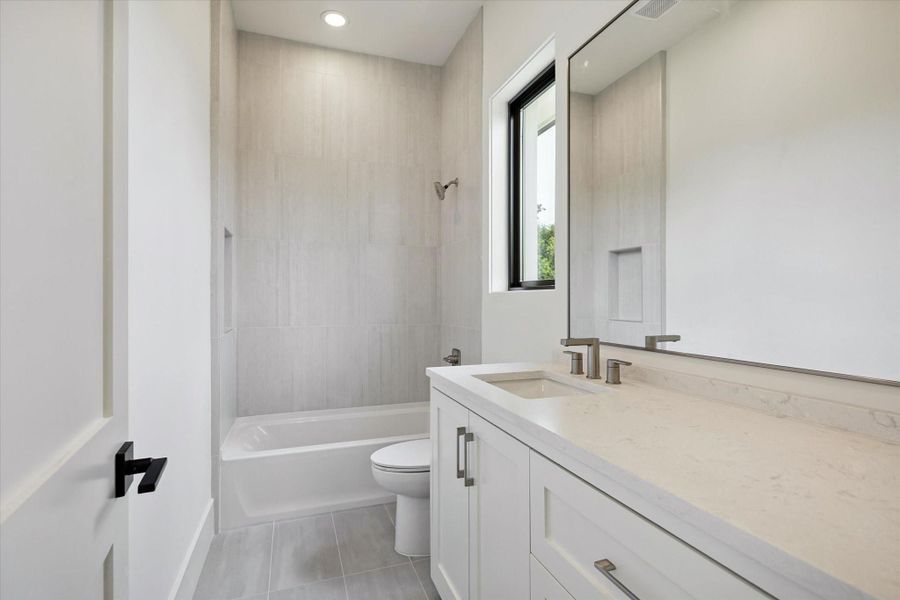 Guest bath with soaking tub and sleek chrome fixtures. Guest bath with soaking tub and sleek chrome fixtures.