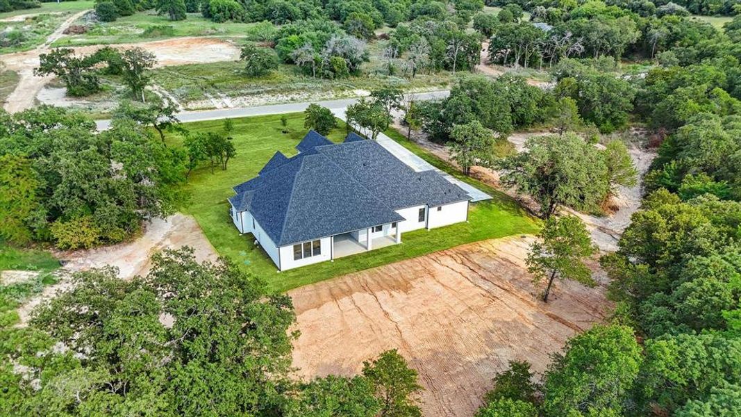 View from above of property with a tree filled landscape View from above of property with a tree filled landscape